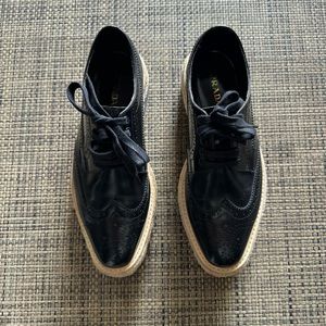 Prada Black Leather Wingtip Lace-Up Shoes with Cream Soles